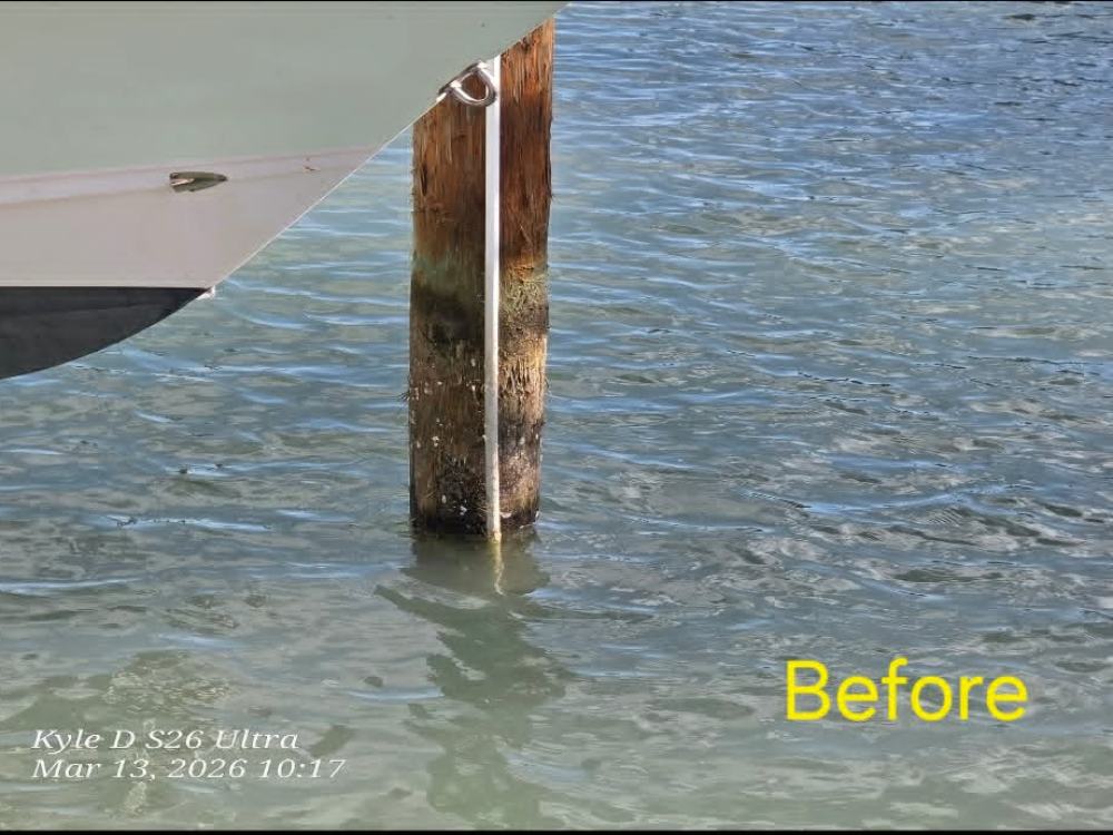 New piling wrap before cleaning, covered in barnacle and marine growth